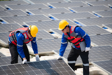Photovoltaic engineers work on floating photovoltaics. Inspect and repair the solar panel equipment floating on the water.