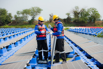 Photovoltaic engineers work on floating photovoltaics. Inspect and repair the solar panel equipment...