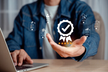 Businessman holding and showing the best quality assurance with five stars, ISO certification and...