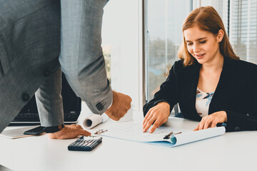 Architect and engineer working with construction drawing project on table in office. Architecture...