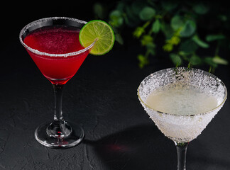 martini glasses of red and coconut alcohol drinks