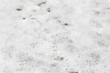 View of the white foam from the spray of the waves of the sea.