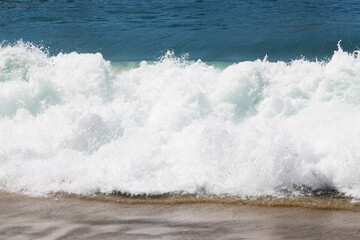 View of the spray from the wave of the sea or ocean.