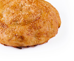 Puff pastry bun rolled up in the form of a snail