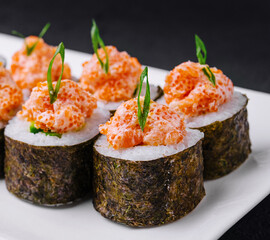 Sushi roll with salmon and caviar