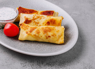 thin pancakes on plate top view