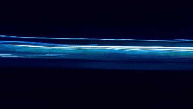 Night timelapse of a speedy night drive in a city.