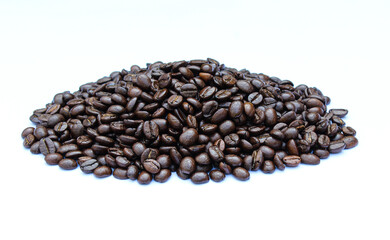 Roasted coffee beans on white background close-up view 
