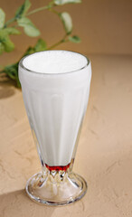 Iced coffee in glass on stone