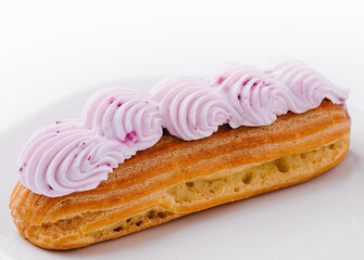 eclair whipped pink cream on plate