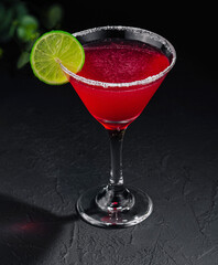 martini glasses of red alcohol drink on stone