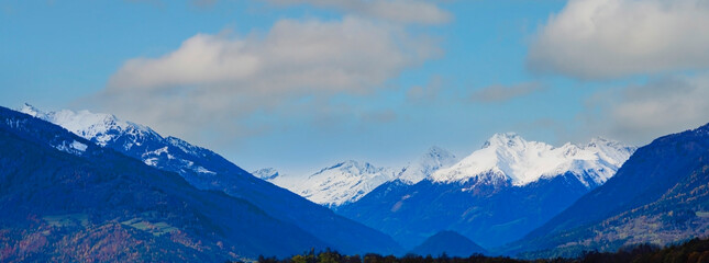 The banner mountain view of alpine as snow-capped mount peaks scene  in Winter mountains background