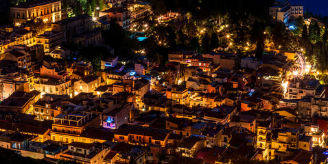 Beautiful view of night town of Italy with colorful golden lights, night landscape on city of Europe