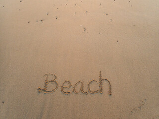 Fototapeta na wymiar Palabra playa escrita en inglés 