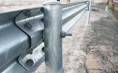 Hot dip galvanized steel w-beam guardrail.