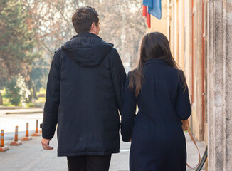adult, autumn, back, back view, background, beautiful, boyfriend, building, caucasian, city, couple, date, day, family, fashion, fashionable, female, girl, girlfriend, hold hands, holding hands, holid