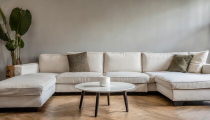 round coffee table near white sofa against blank wall with copy space minimalist cozy home interior design of modern living room