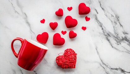 valentines day flat lay big and small red hearts and red cup on white marble background top view place for text