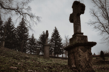 Old Stone Cross - Grave -  Graveyard - Scary - Cemetery - Halloween - Mysterious  - Tombstones - Background - Concept - Religion - Spooky - Creepy 