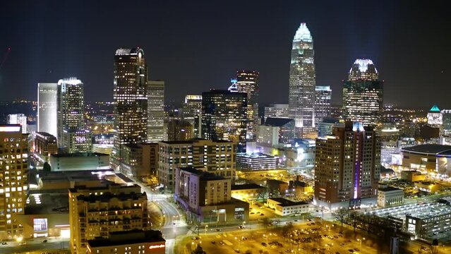 Aerial Shot Of Illuminated Modern City Against Clear Sky, Drone Flying Backwards At Night - Charlotte, North Carolina