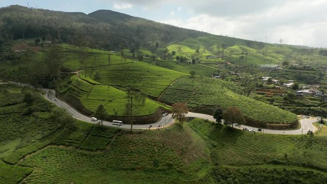 DJI_0114A highway among the perfect patterned tea plantations around Nuwara Eliya in Sri Lanka