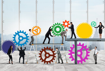 Teamwork of businesspeople work together to a system of gears as integration concept