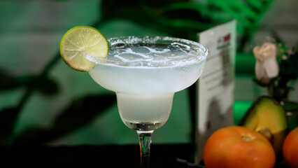 Close-up photo of a zesty margarita adorned with refreshing citrus slices