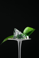 glass with green leaf