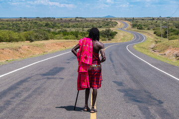 Fototapeta premium Globalisation and tribes - Maasai Warrior on Road