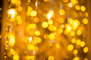 close-up blurred photo Golden decorative lights create a luxurious atmosphere at night events. Helps to take beautiful