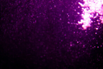 Abstract purple bokeh glitter lights defocused