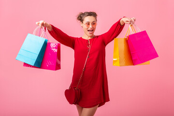 attractive happy smiling stylish woman holding shopping bags