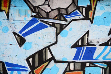 Colorful background of graffiti painting artwork with bright aerosol outlines on wall. Old school...