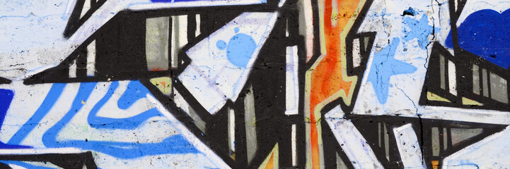 Colorful background of graffiti painting artwork with bright aerosol outlines on wall. Old school...