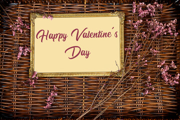 happy valentine's day on golden picture or photo frame mockup with pink baby's breath, gypsophila...