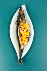Roasted mackerel fish with oranges.