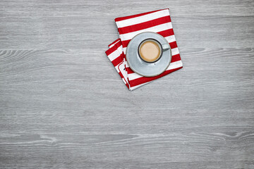 a cup of milk coffee on wood table. Flat lay, top view cappuccino cup. Empty place for text, copy space. Coffee addiction