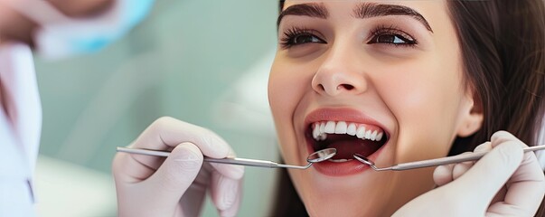 dentist examined or drilling tooth to patient. Dentist and patient in dentist clinic - Powered by Adobe