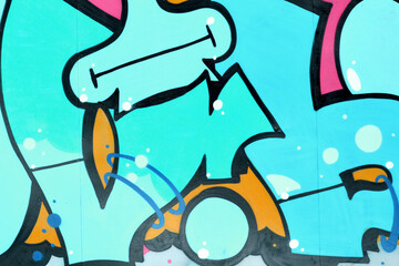 Colorful background of graffiti painting artwork with bright aerosol outlines on wall. Old school...