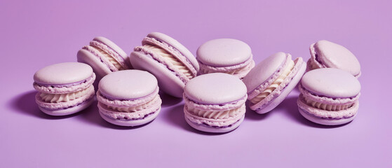  Close up of purple macarons with decorations on purple background . Pastry food mockup.Minimal. Generative ai