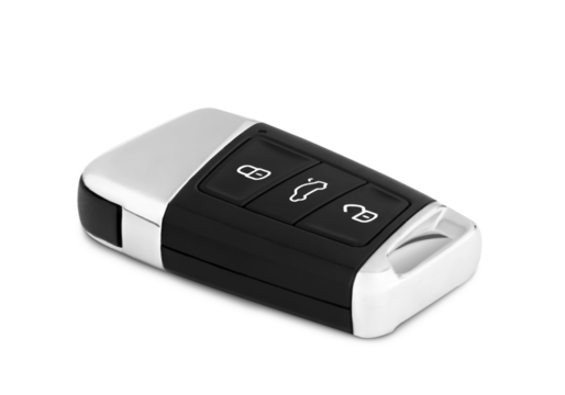 Car ignition key close up isolated. The key is made of black plastic and a metal insert, with three buttons.