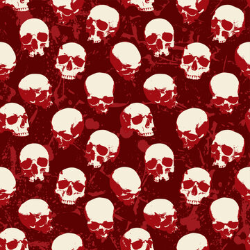 Seamless pattern with human skulls with stains and blood spatters. Vector background with sinister smiling skulls in retro style. Graphic print for clothes, fabric, wallpaper, wrapping paper
