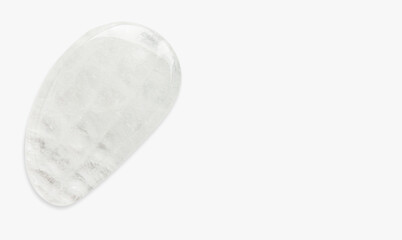 White stone for facial massage. Guasha quartz. on a light background.