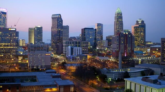 Aerial Shot Of Illuminated Buildings In Modern Downtown District, Drone Flying Forward At Night - Charlotte, North Carolina