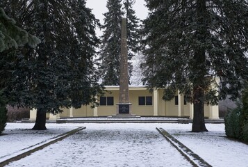 Gustrow, Germany - Jan 12, 2024: This war cemetery contains the graves of 545 killed Soviet soldiers, prisoners of war and forced laborers during Second World War. Cloudy winter day. Selective focus