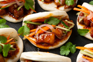 Bao buns with pork belly and vegetable. Asian cuisine