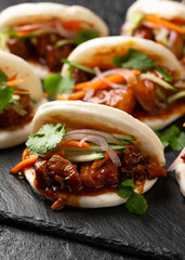 Bao buns with pork belly and vegetable. Asian cuisine