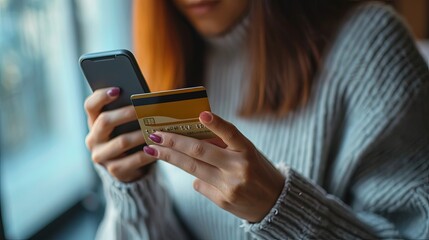Young woman hands holding credit card and smartphone. Online shopping. Empowering consumers with the power of technology.