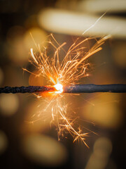 A close up of burning sparkler