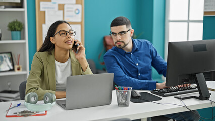 Two canny coworkers, the tale of a cheating man and woman using a smartphone and computer in the office